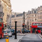 A Street With Cars And Buses On It