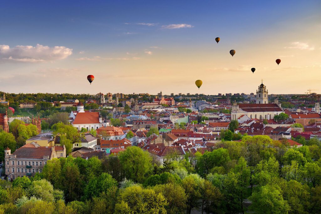 Hot Air Balloons Flying Over A City