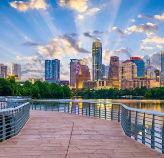 a city skyline with a body of water