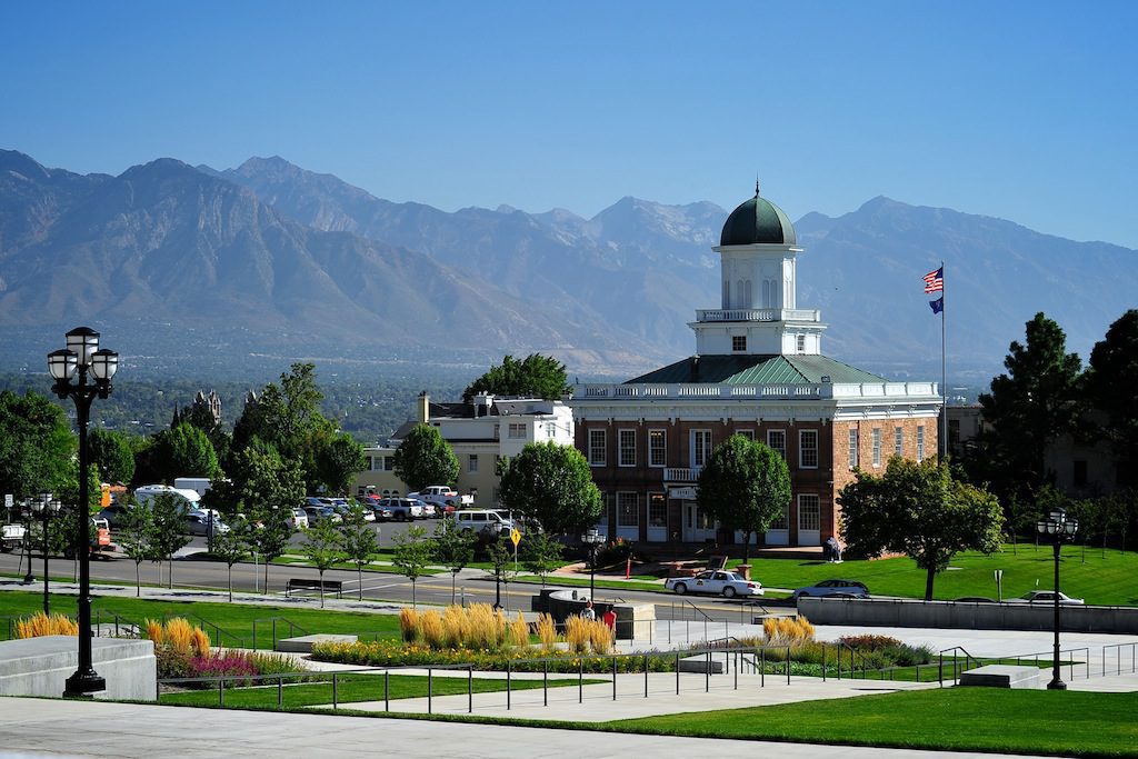 A Building With A Dome And A Flag On Top