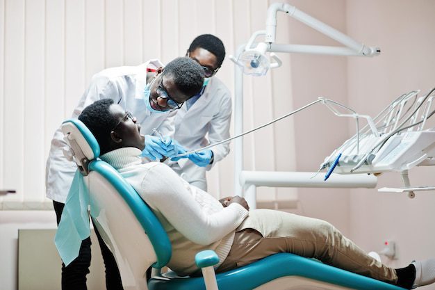 African American Man Patient Dental Chair Dentist Office Doctor Practice Concept Professional Dentist Helping His Patient Dentistry Medical Drilling Patient S Teeth Clinic 627829 13721