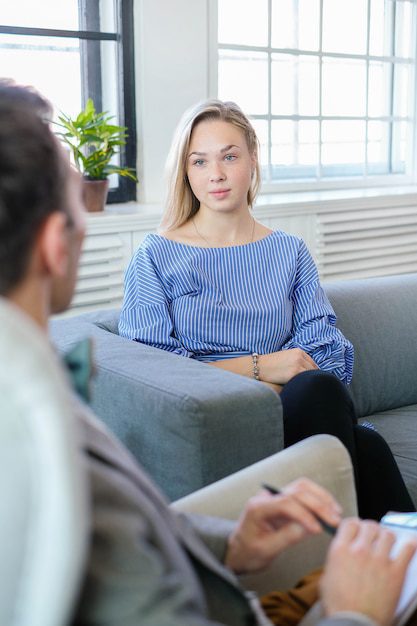 a woman sitting on a couch