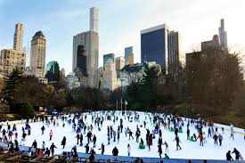 A Group Of People On A Large Ice Rink With Central Park In The Background