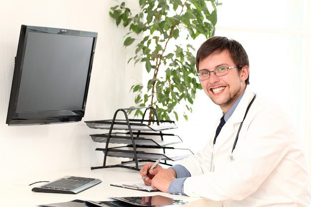 Young Doctor Working His Office 144627 25755